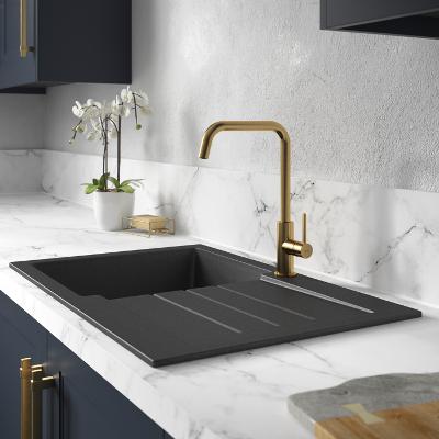 black sink and gold tap