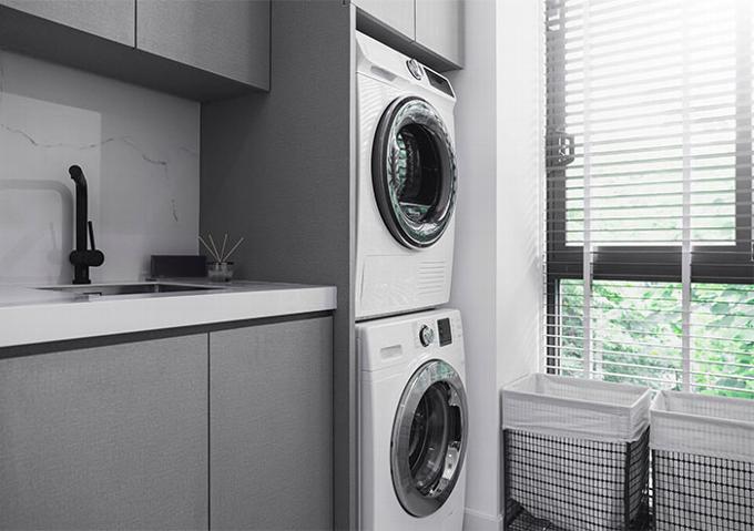 utility room with washing machine, dryer and sink