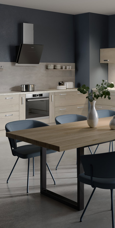 A kitchen with blue walls and a dining table
